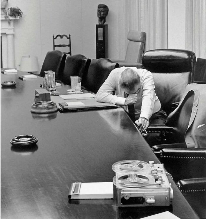 Lyndon Johnson listening to a tape from his son-in-law, sent from Vietnam, 1968.