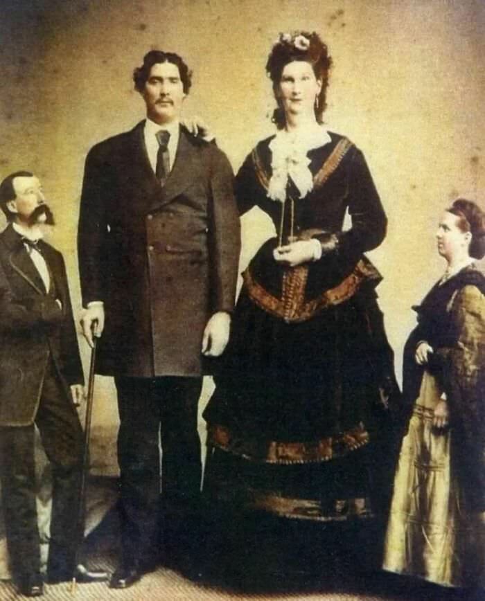 One of the tallest women in history, Anna Haining Bates, at 7'11" (241 cm), poses for a photo with her 7'8" (234 cm) husband, Martin Van Buren Bates in the 1870s.