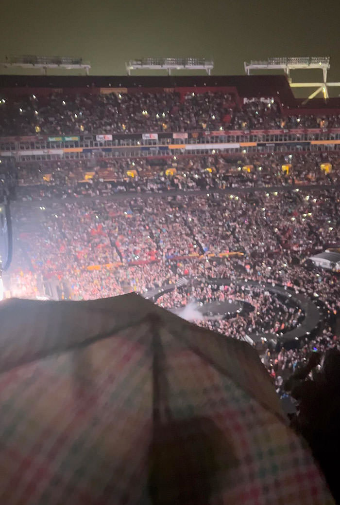 Went to a concert and got the umbrella view (yes, I asked her to put it away, but she did not).