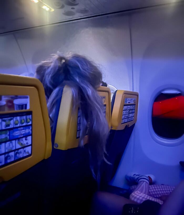 Girl sitting in front of my wife on a flight. She did that 5-6 times during a 3-hour flight. When telling her, she was quite annoyed… I mean, “What is wrong with my hair above your book/food/whatever?”