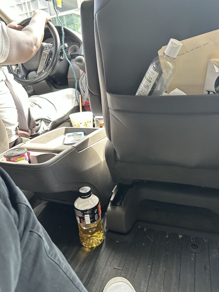 My Uber driver has a urine bottle sitting inches away from my foot.