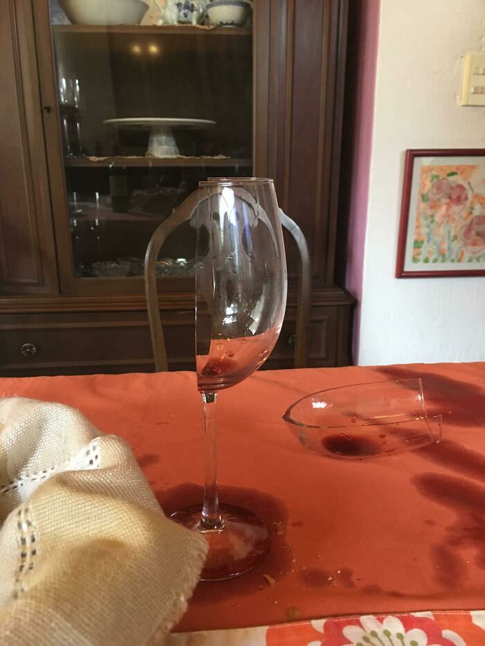My aunt spilled the wine, and the glass broke exactly in half.