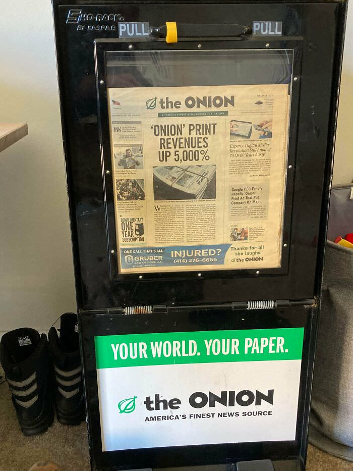 I have this Onion newspaper box with the last-ever print issue still in the display window.