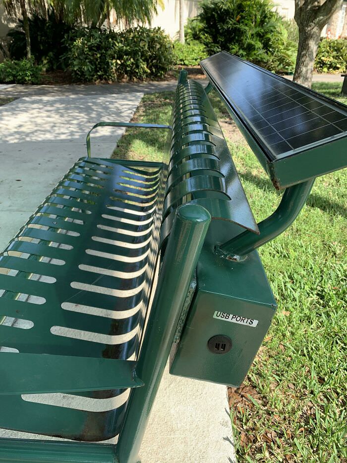 Solar park bench with USB charging ports.