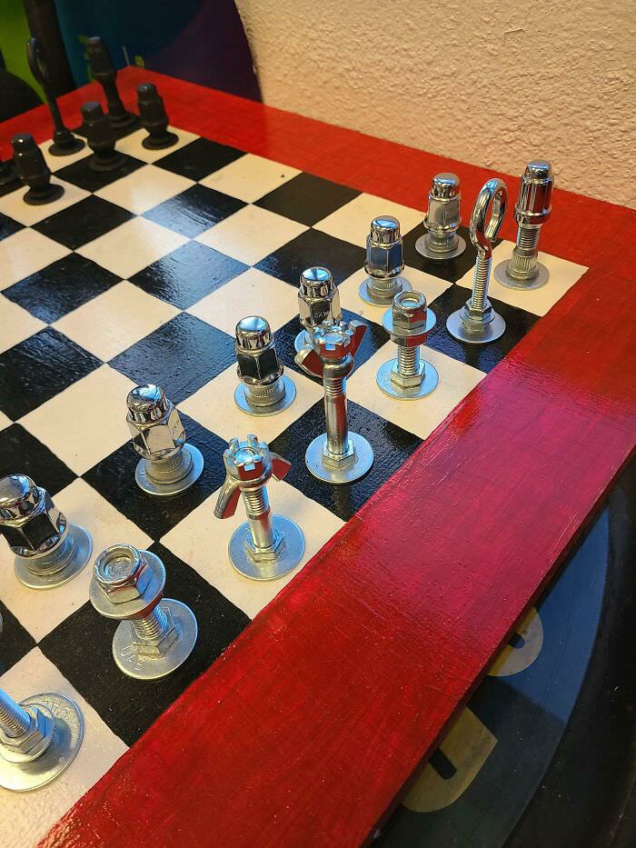 Chess pieces made out of hardware.