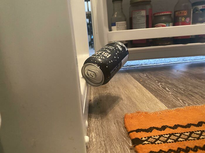 A beer can fell out of our fridge and landed like this.