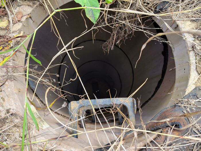 Going back through sewer inspection photos, and I realized something had been looking back at me from the bottom of a 12-ft deep sanitary manhole.