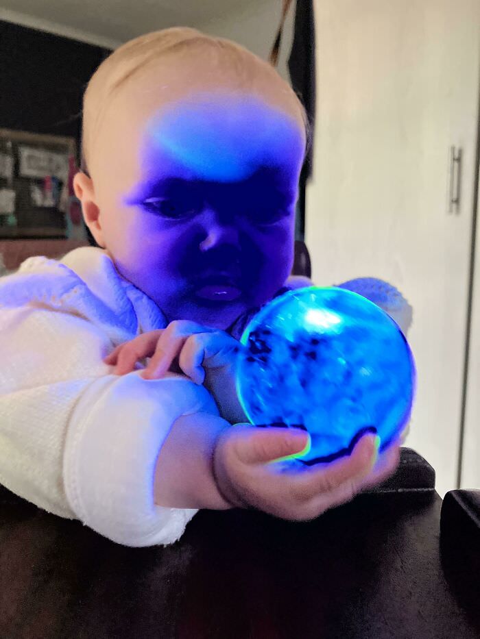 Took a photo of my baby playing with a light-up ball. No filters.