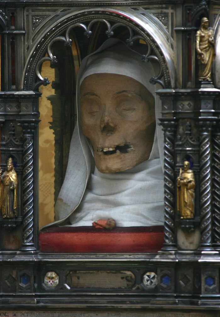 The mummified head of Saint Catherine of Siena (1347-1380) on display at the Basilica of San Domenico, Siena, Italy.