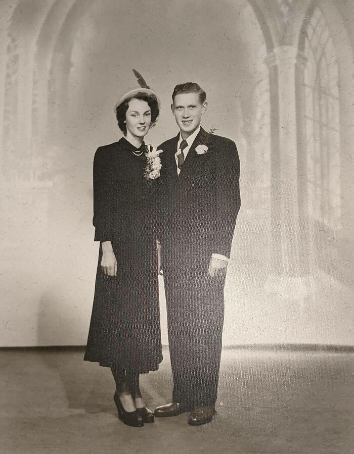 My grandparents' wedding photo from the 1940s. Poor farmers, they couldn't afford a real wedding dress, so Grandma wore her best Sunday dress, which happened to be navy blue.