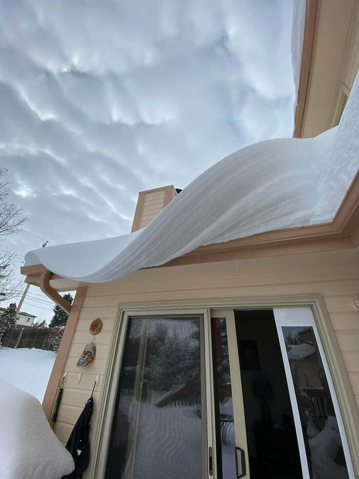 Took this picture of the snow wave on my roof today.