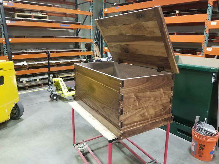 A blanket chest I made for my future wife, we get married on Saturday. It's made out of walnut wood and brass plugs.