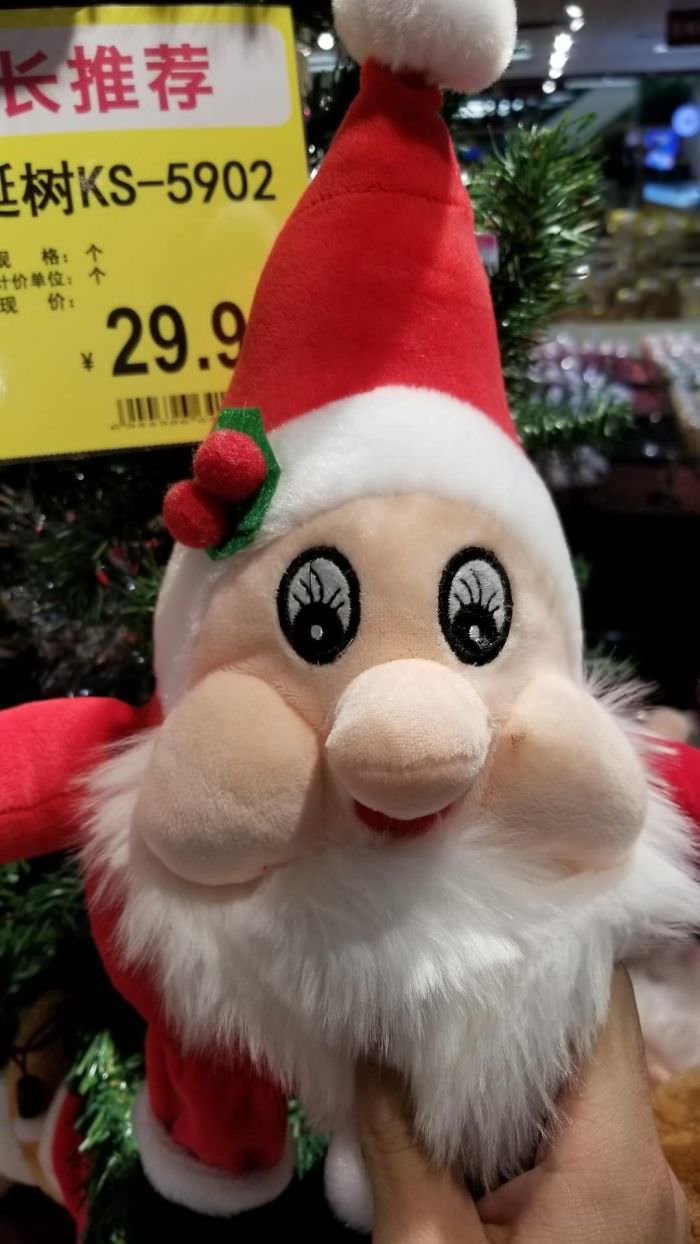 This Santa plush's eyelashes are misplaced.
