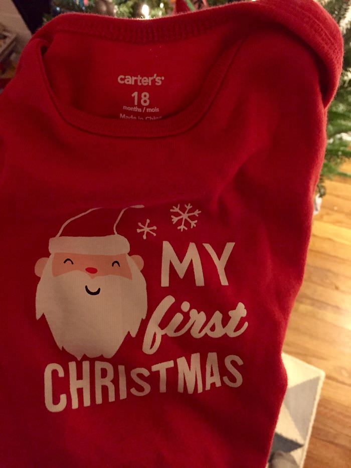 'My First Christmas' onesie sized for 18-month-olds.