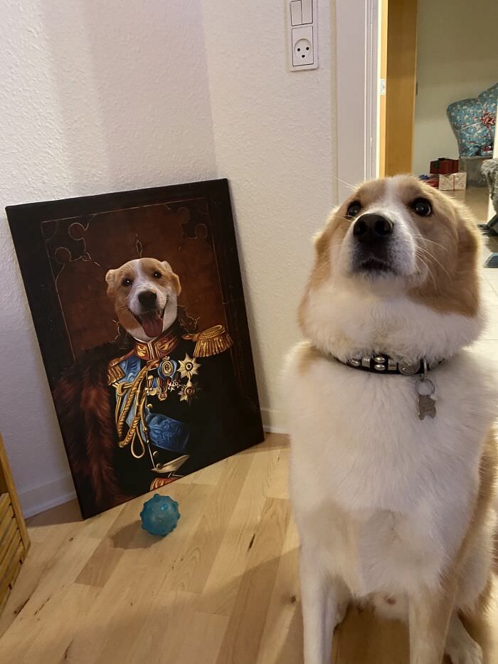 Ollie next to the painting he got for Christmas.